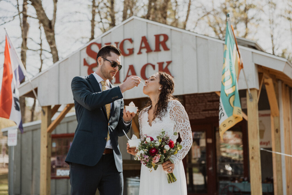 Bride and groom share maple creemees at Sugar Shack in Arlington, VT