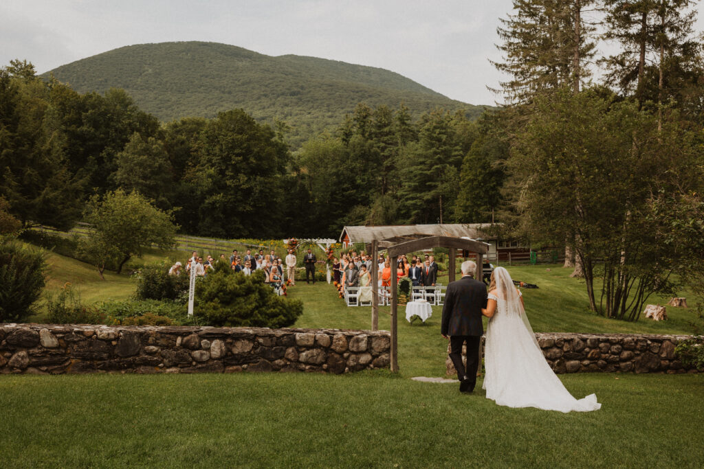 Bride's father walks her down the aisle at the West Mountain Inn in Arlington, VT