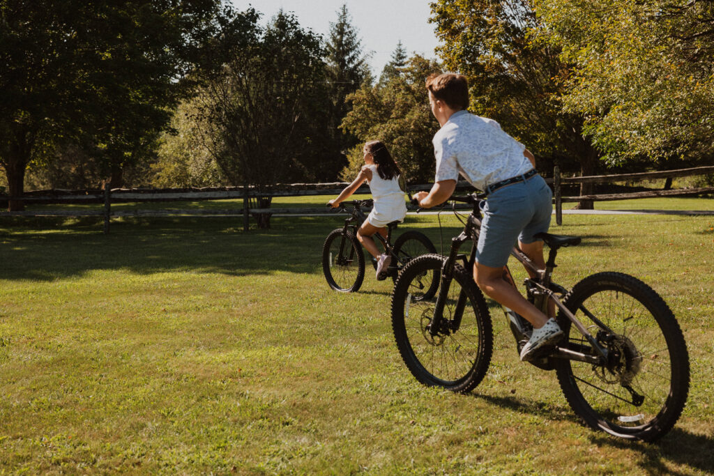 Two kids riding bikes together