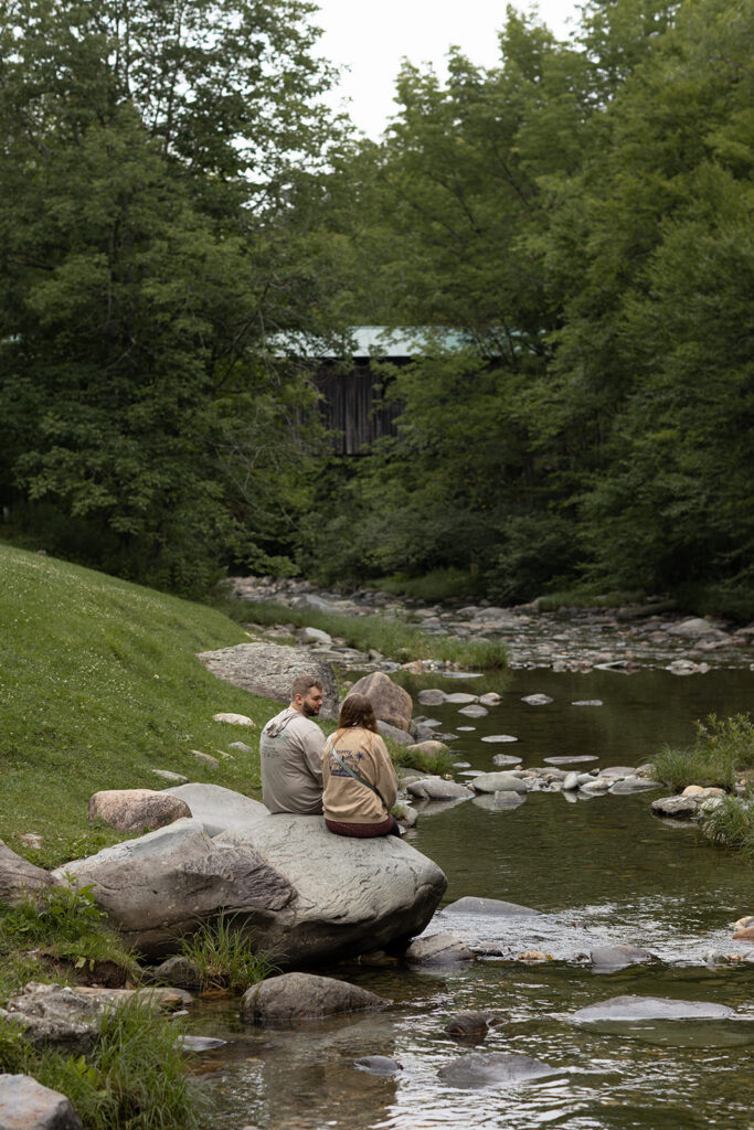 Couple enjoying view of a Vermont covered bridge